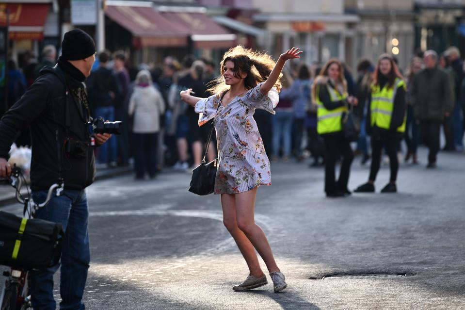  A girl in a shirt and trainers dancers amid wild celebrations in Oxford