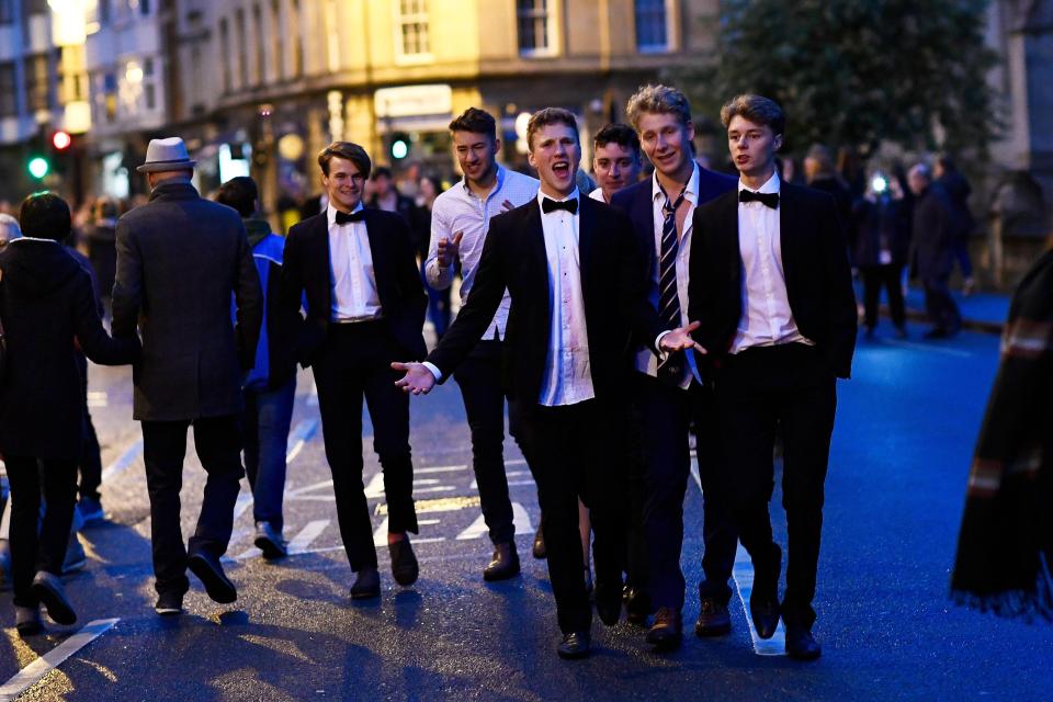  Revellers in their dinner jackets look worse for wear as they wait for the sunrise in Oxford