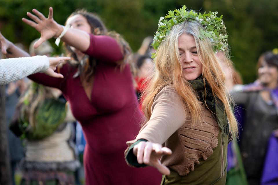  Dancers enjoy the sunshine at Chalice Well, Glastonbury