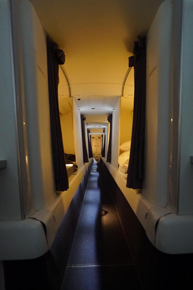  The small capsule beds are tucked above business and economy class