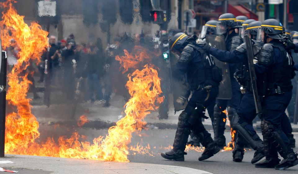  Cops battled black-clad activists with their faces covered protesting against Marine Le Pen's first round election win