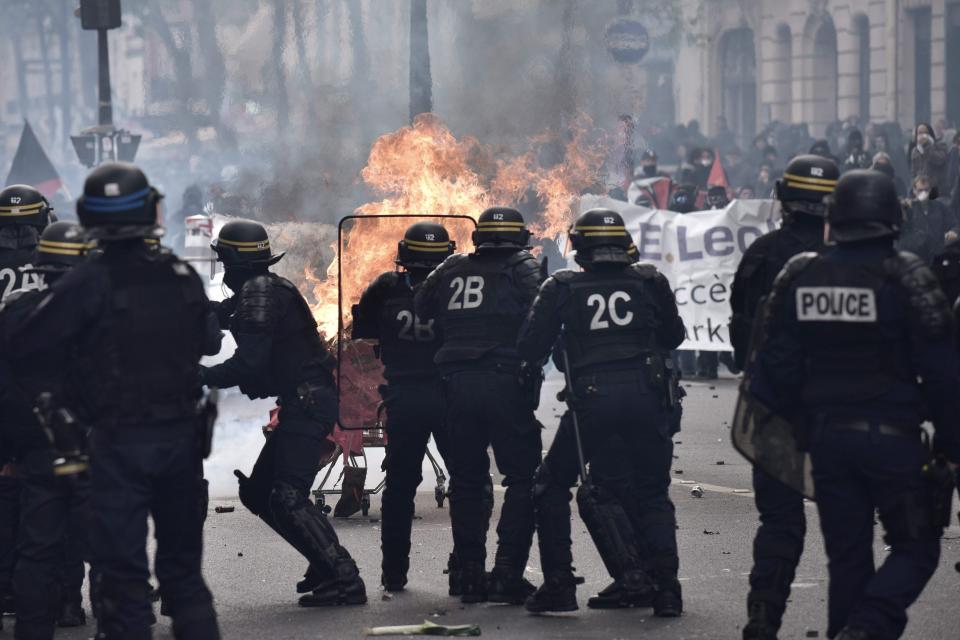  The march soon turned violent, with protesters launching a burning trolley towards CRS riot officers