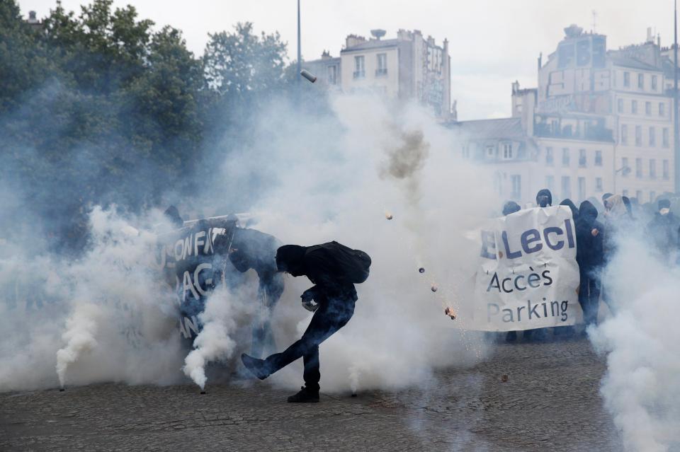  Police fought back with tear gas and baton charges to try to keep the crowd at bay amid ugly scenes in the French capital