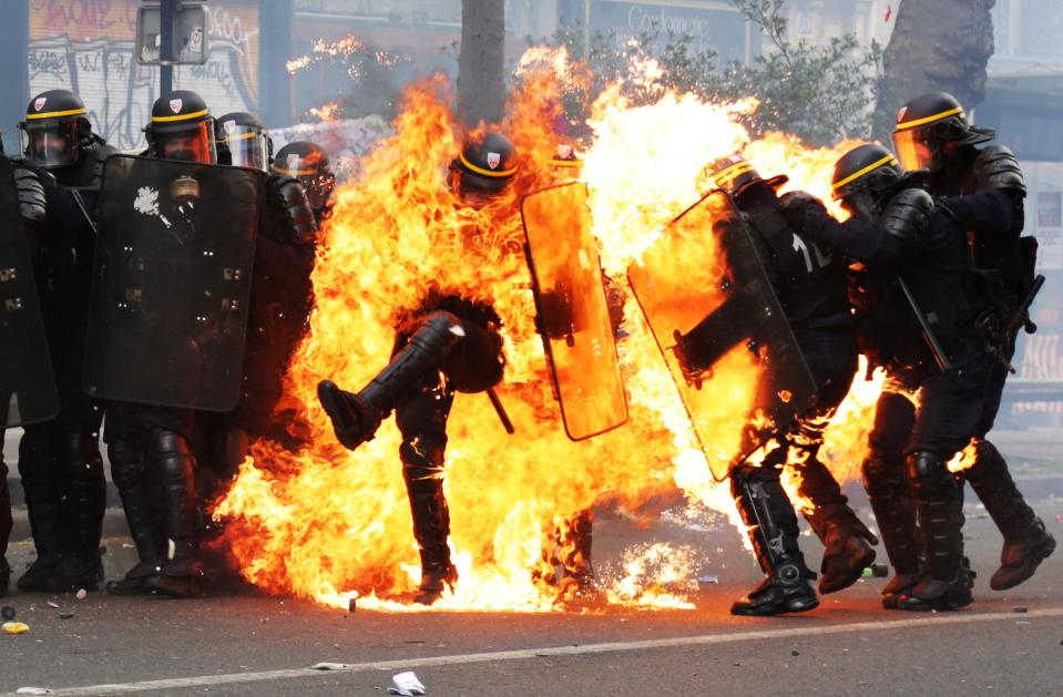  At least three officers are reported to have been injured during clashes with protesters in Paris