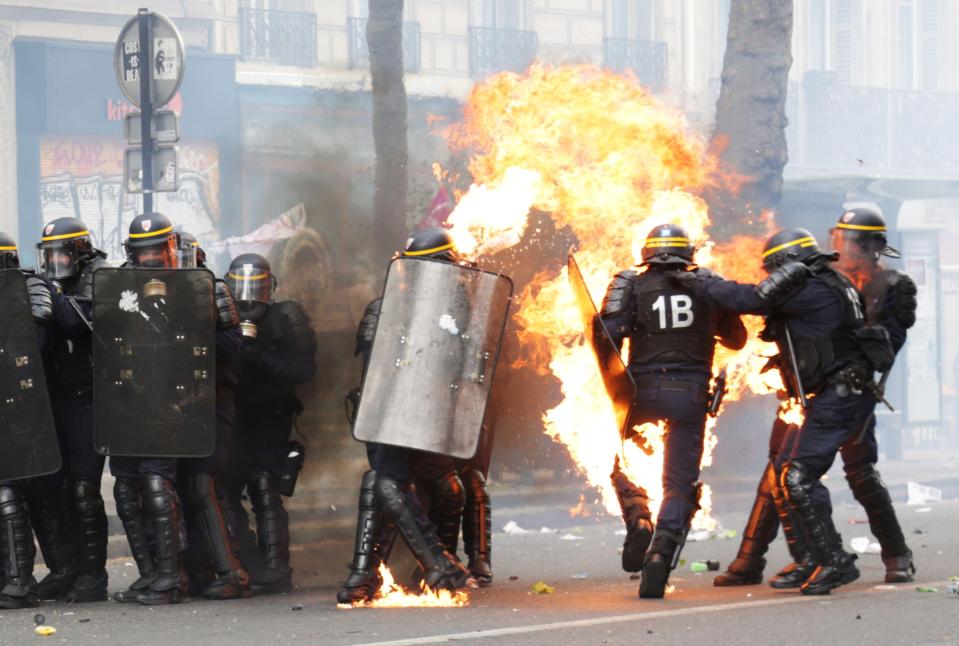  One of the injured riot cops is said to have suffered bad burns from a Molotov cocktail thrown by demonstrators