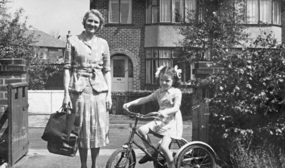  Middle class people lived in much larger houses. Pictured is Hilda Parry and her daughter Hilary on her bike outside their home in Worsely, Lancashire in 1952