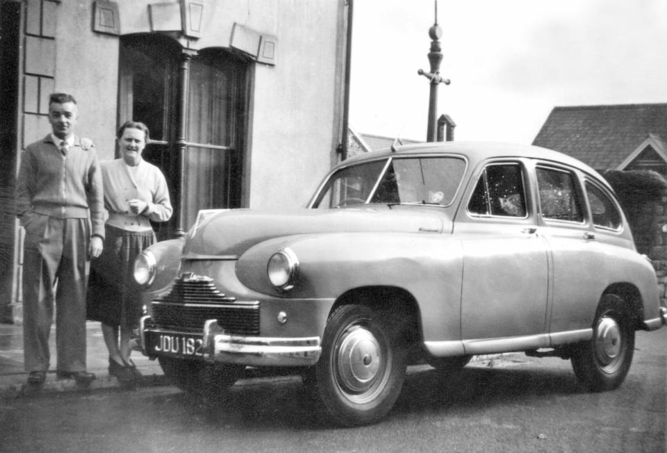  Married couple Eric and Nora Phillips proudly display their Standard Vanguard car outside their home in Llanellu in 1955