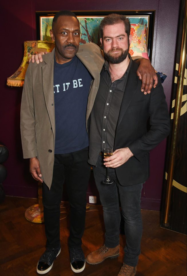  Sir Lenny, 58, posed with his arm around director Simon Evans