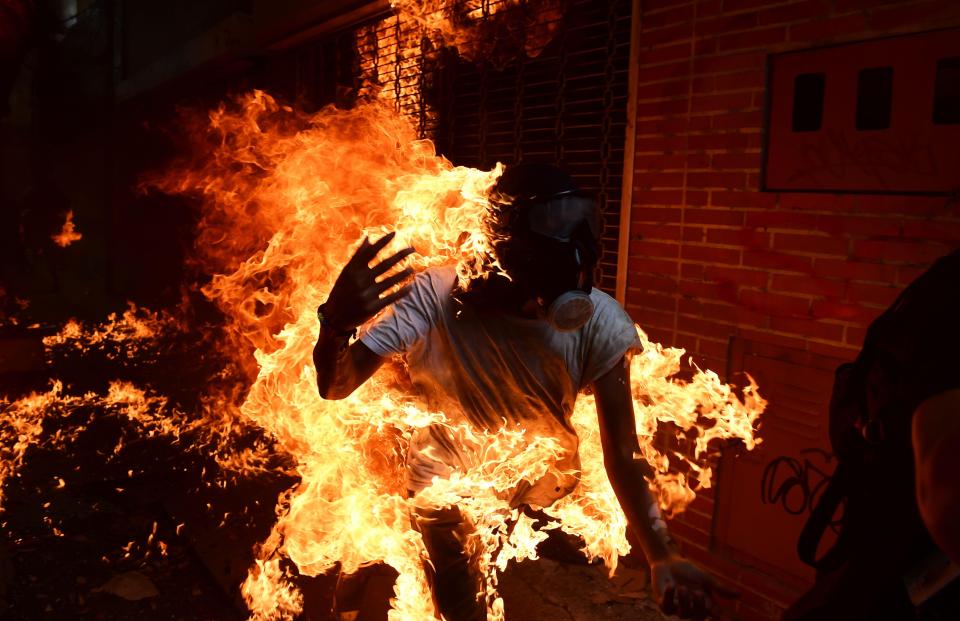  A protester is engulfed in flames during anti-government protests in Caracas