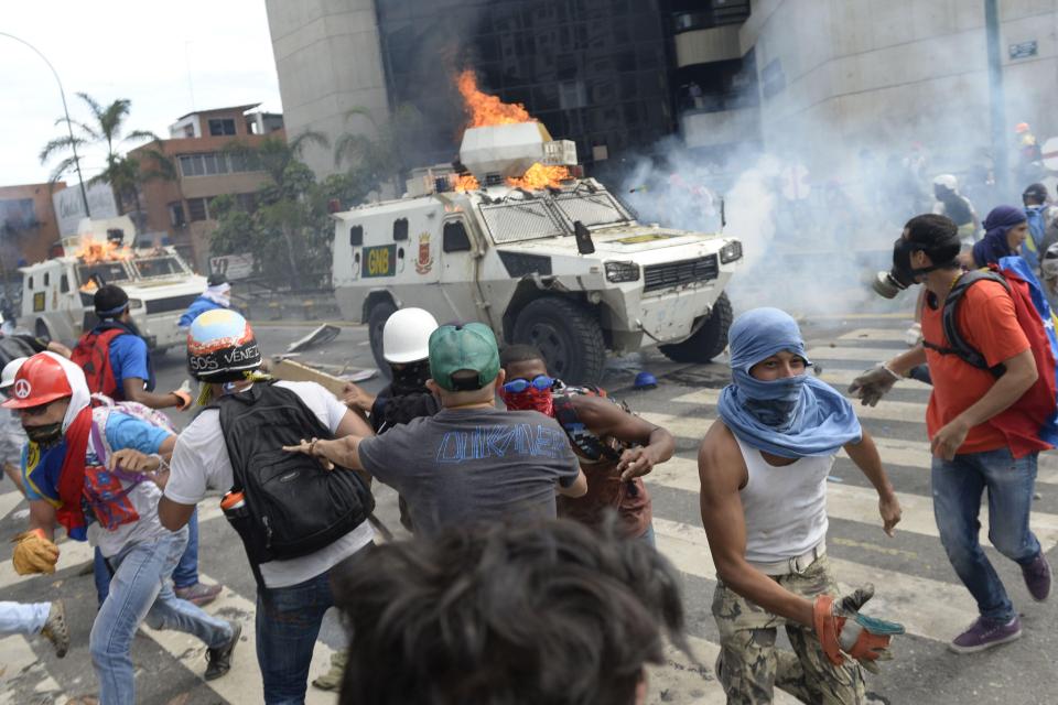  Police responded with tear gas and rubber bullets after protesters threw petrol bombs and stones