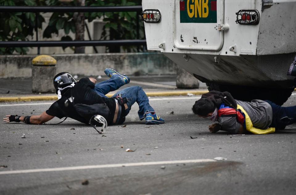  He and another man were hit by the vehicle after they reportedly charged towards it amid ugly clashed in Caracas