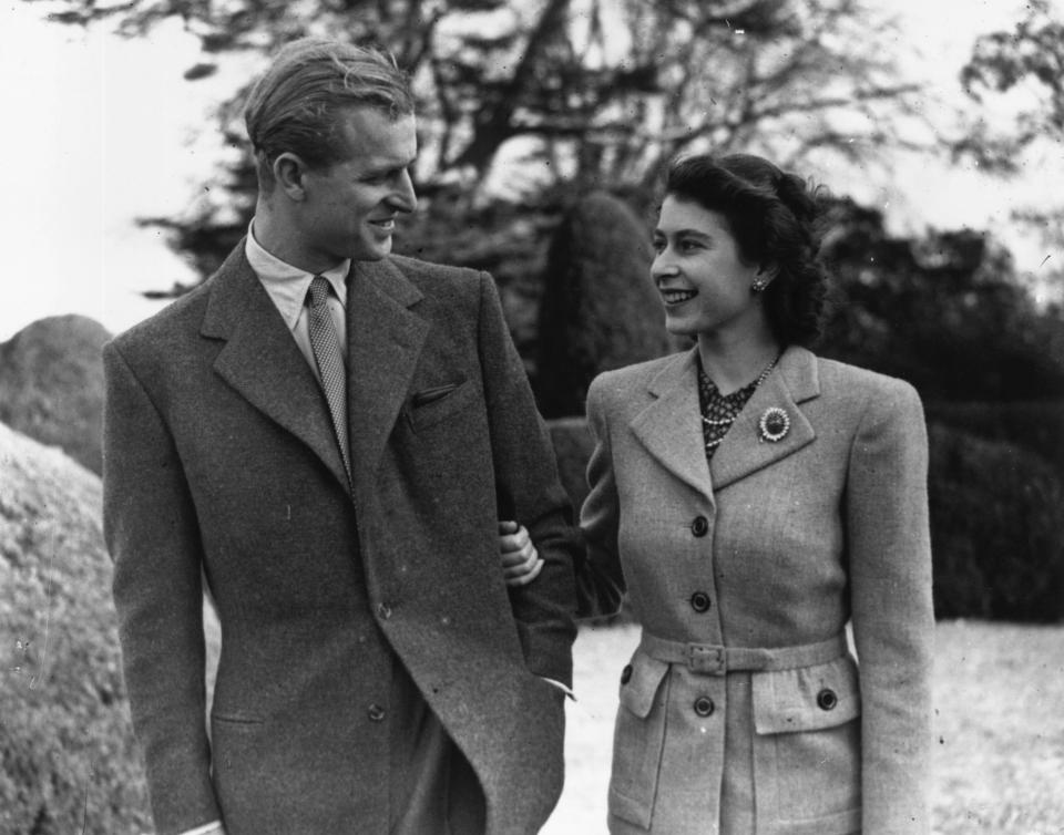  Arm-in-arm and gazing into each others eyes, honeymooners Princess Elizabeth and Prince Philip enjoy a stroll at his uncle's home, Broadlands, Hampshire