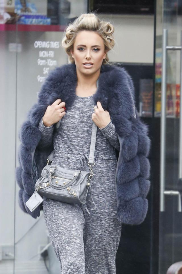  Earlier today Amber stepped out in Essex with rollers in her hair and wearing trendy slider shoes