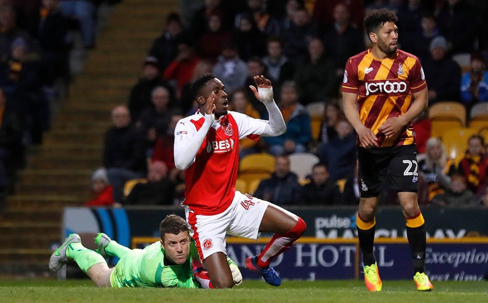 Doyle dives as the feet of Fleetwood striker Devante Cole in the play-off semis