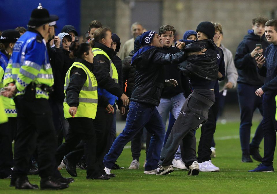  Millwall supporters were snapped fighting amongst themselves at the full-time whistle