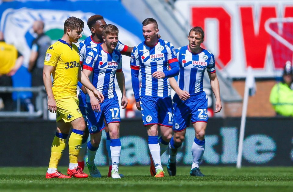  Wigan's Ryan Tunnicliffe is congratulated by his team-mates after netting early on