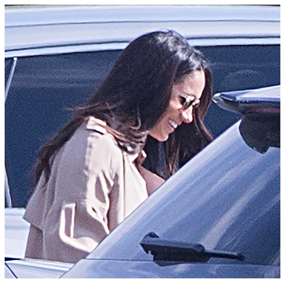  In excellent spirits ... Meghan Markle was snapped with a dazzling grin plastered on her face