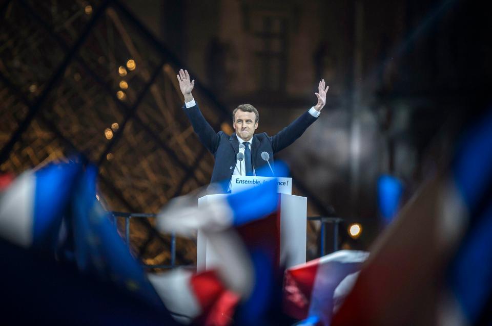  Emmanuel Macron celebrates on stage at the Carrousel du Louvre in Paris after winning