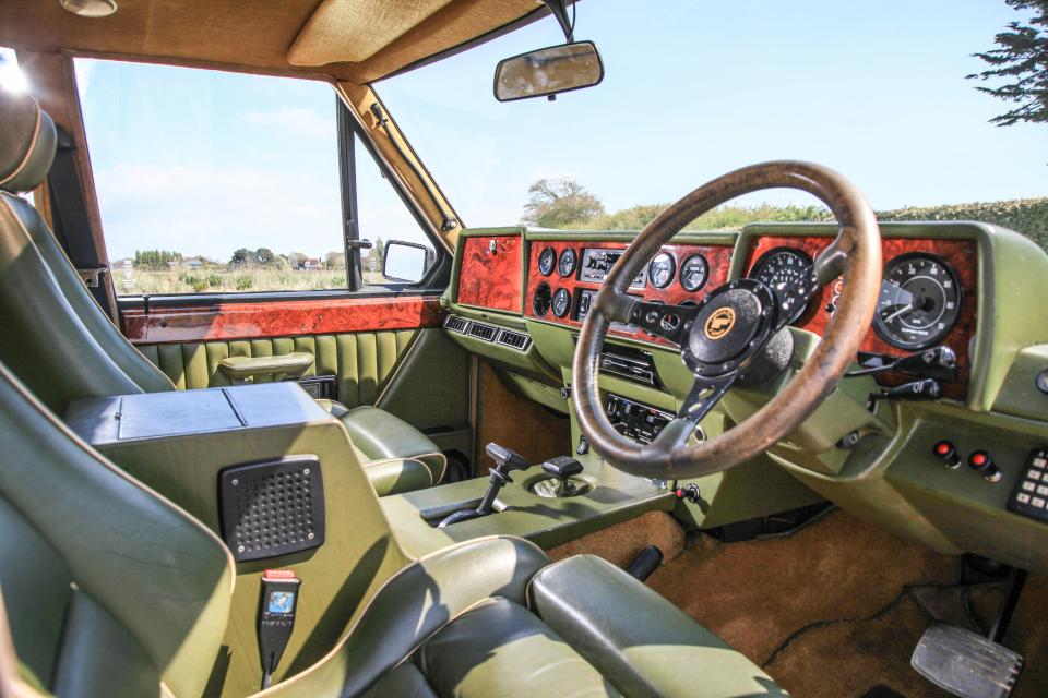  Trimmed in Harrods green, leather seats compliment a burr walnut dashboard