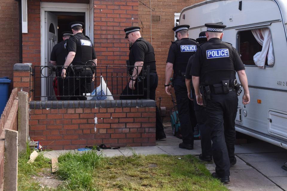  Police arrive at the Liverpool home as investigations continue after a young girl was attacked by dogs