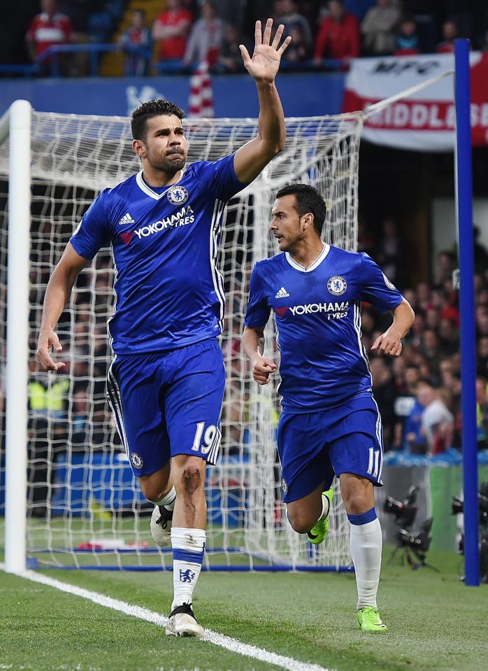  After putting his side into a 1-0 lead, Diego Costa wheels away to celebrate with the fans