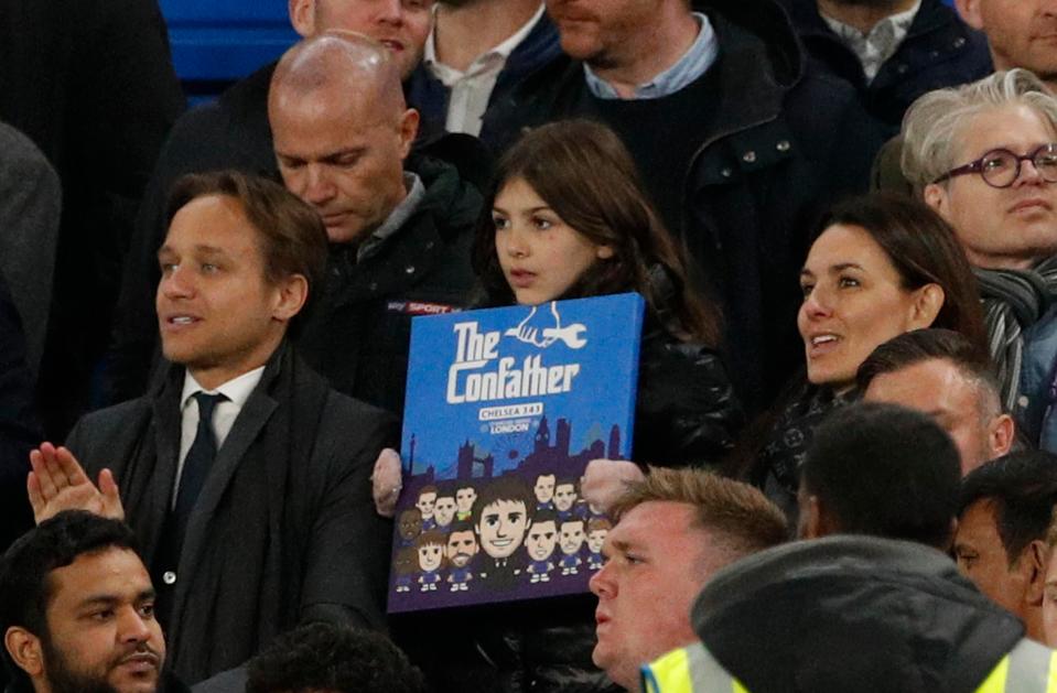  Daughter of Chelsea manager Antonio Conte, Vittoria holds up a sign in the stands as Conte's wife, Elisabetta Muscarello looks on