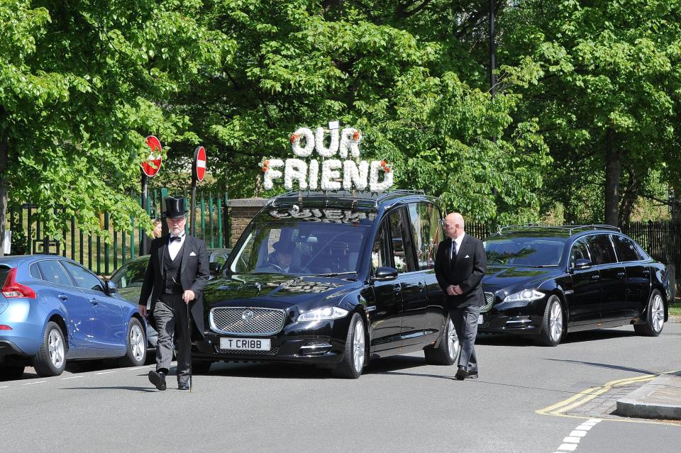  Ugo Ehiogu's hearse makes its way through the streets of north London this afternoon as friends and family gathered to mourn together