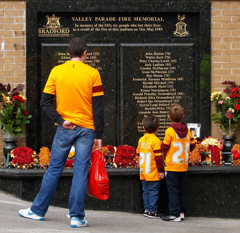  A family take a moment to remember those who lost their lives on that terrible day