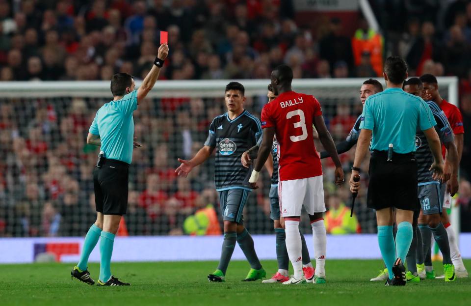  Eric Bailly is shown a red card by the referee