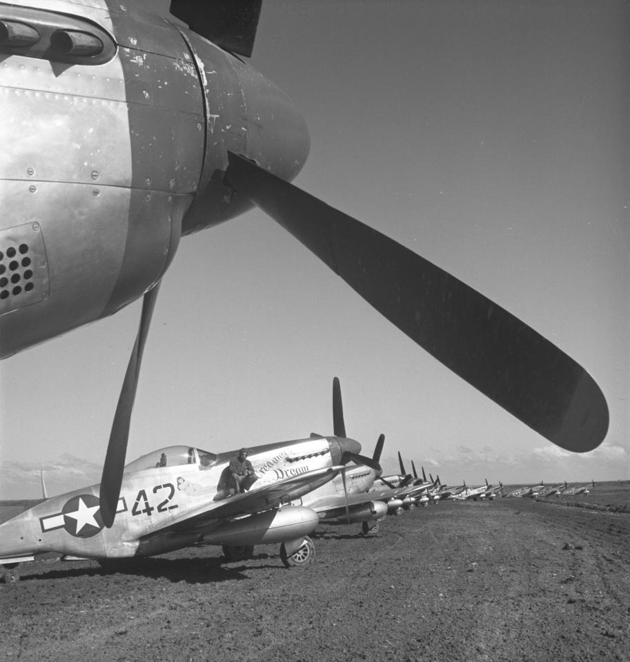  A Tuskegee airman sitting on a P-5/D 'Creamer's Dream' aeroplane in Italy