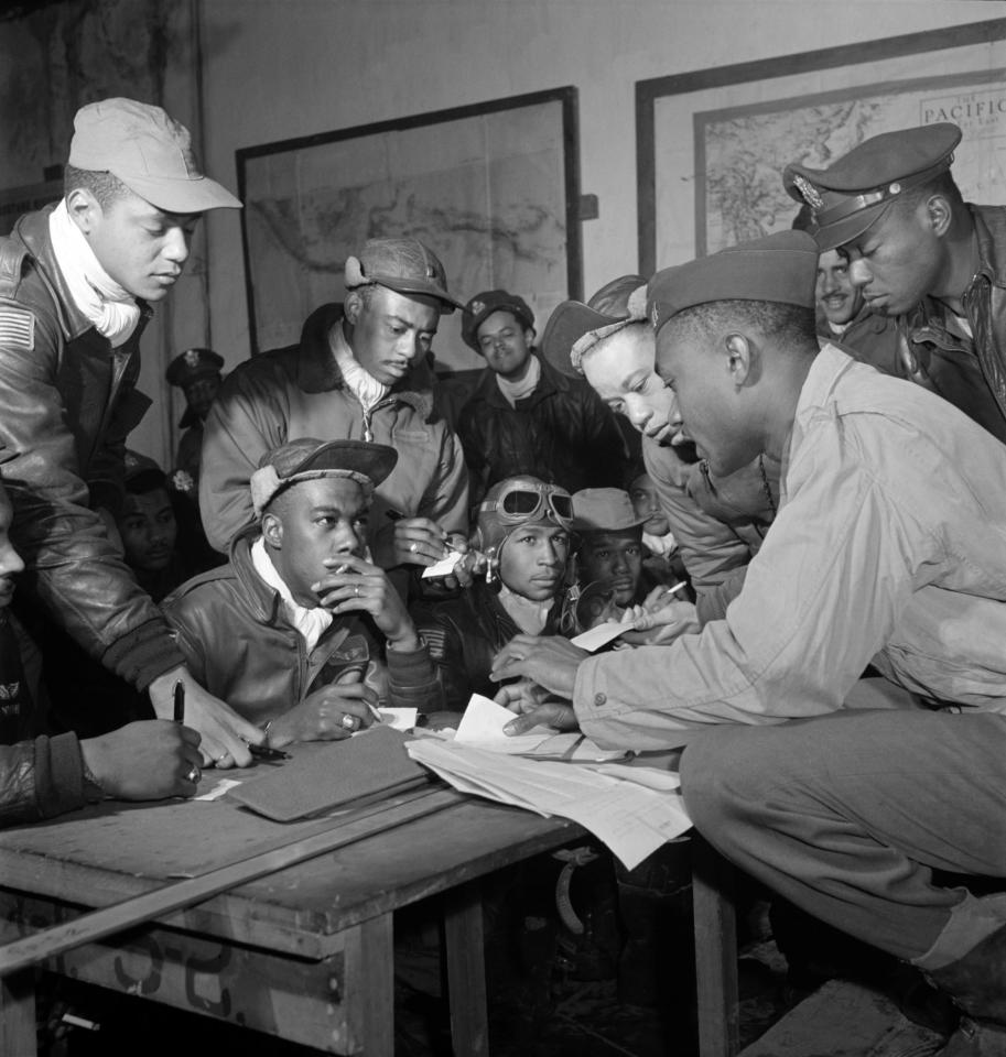  Airmen are briefed ahead of an Allied mission