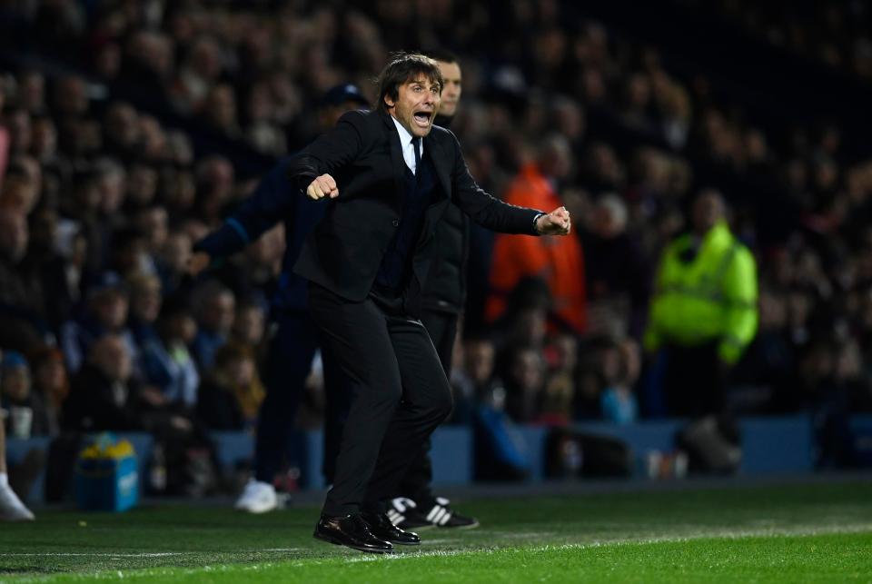  Antonio Conte brakes into one of his trademark celebrations