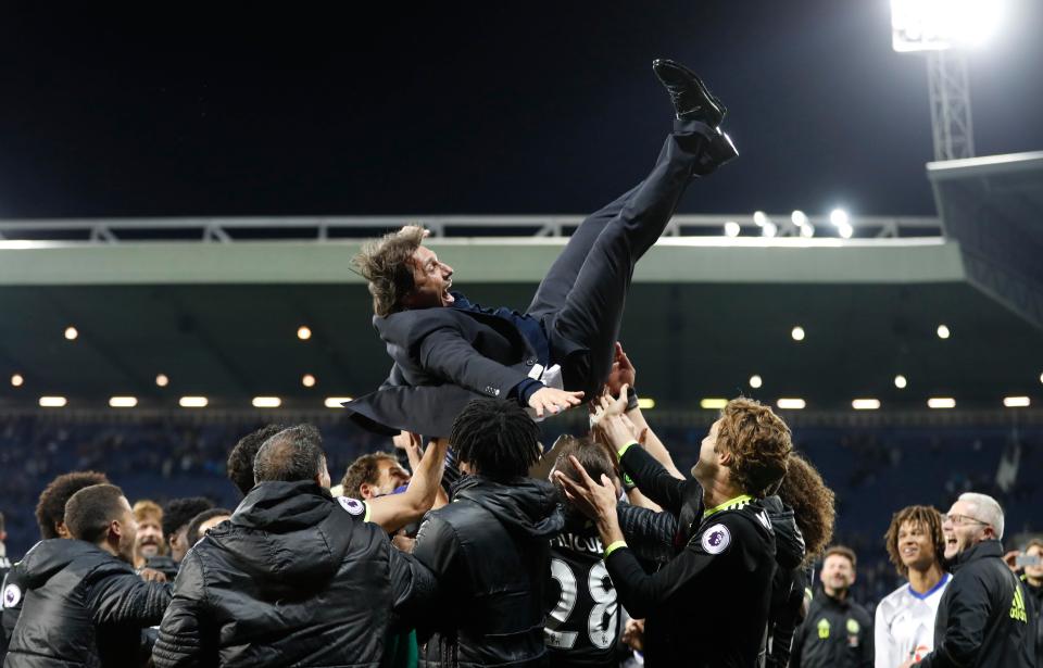  Chelsea manager Antonio Conte is hoisted aloft by his players