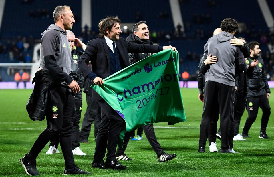  Chelsea manager Antonio Conte holds the champions banner