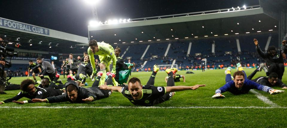  Chelsea players slide in front of their fans after winning the title