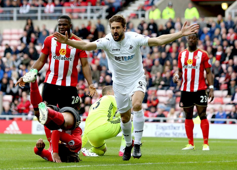  Fernando Llorente wheels away in celebration after his early goal for Swansea