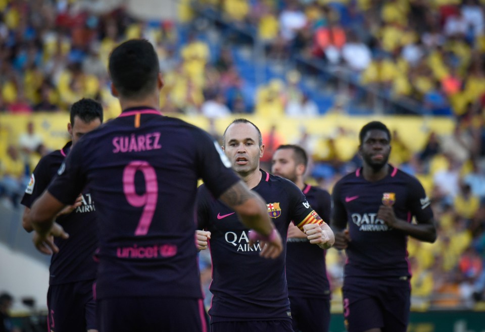 Barcelona players celebrate Luis Suarez’s goal as they went into the half-time break two goals ahead of Las Palmas