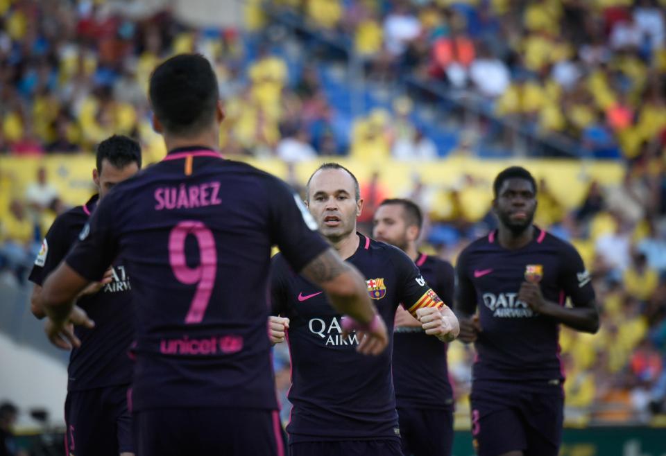  Barcelona players celebrate Luis Suarez's goal as they went into the half-time break two goals ahead of Las Palmas