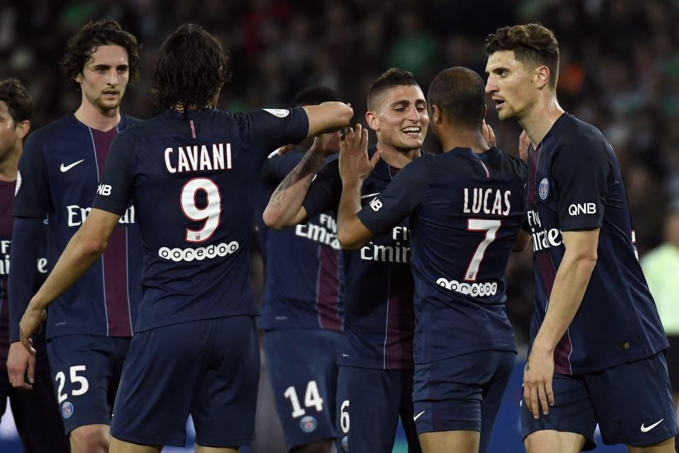  Lucas Moura is congratulated by his PSG team-mates after he doubled their lead shortly before the break