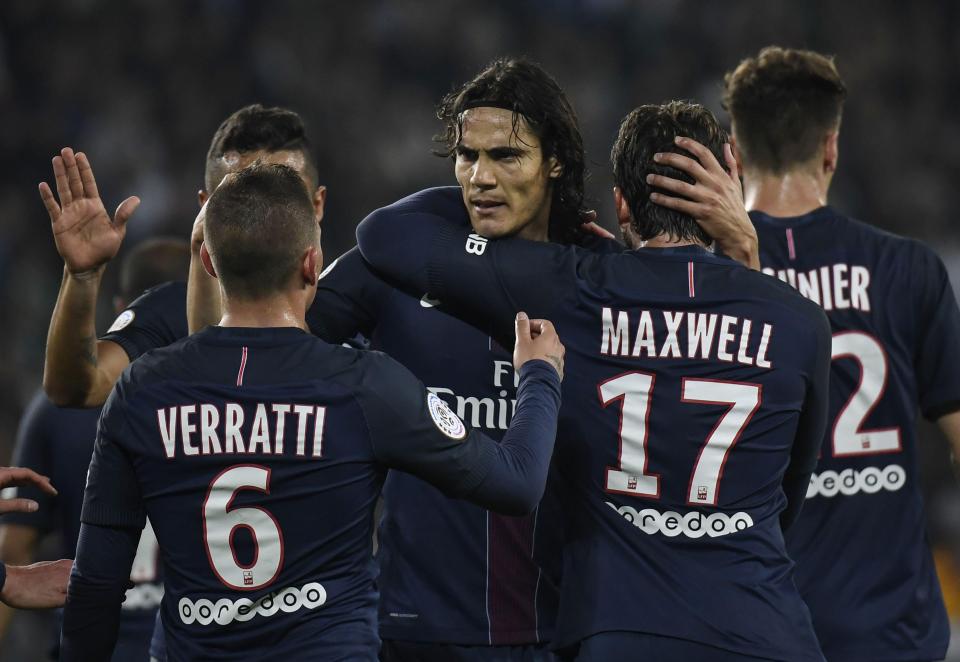  Edinson Cavani is congratulated by his team-mates after he scored his second of the evening