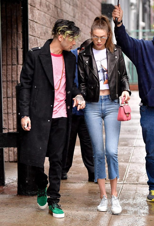  Zayn sported a trench coat and pink T-shirt with black jeans for his outing