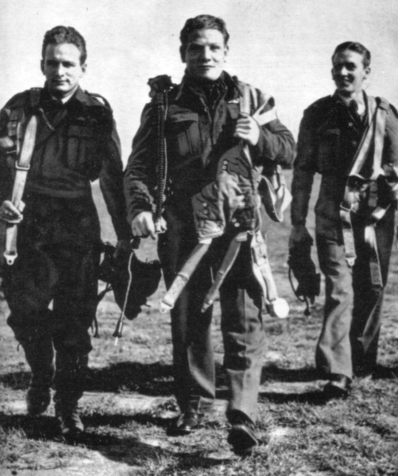  Colin, (centre), returns to the crew room at Aston Down, Glos, after a training exercise with a Canadian pilot