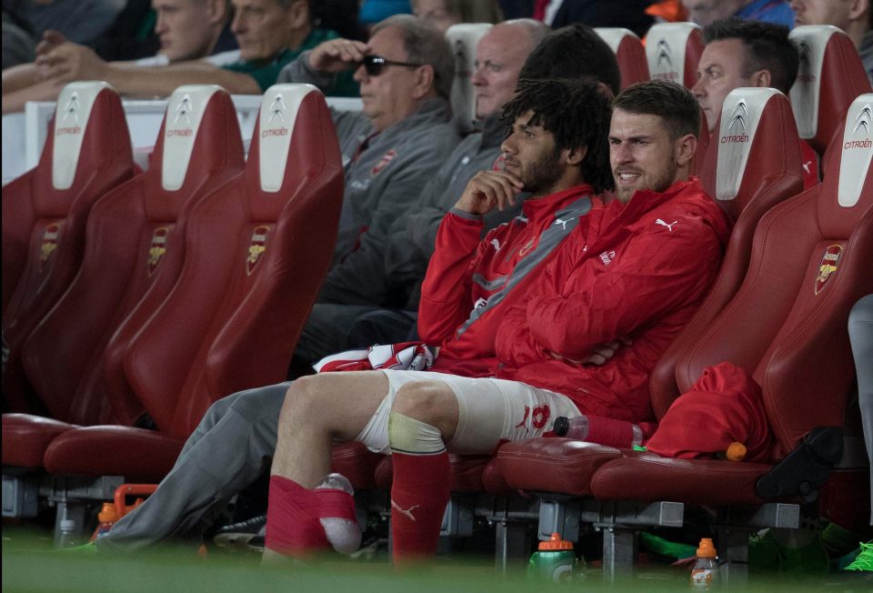  Aaron Ramsey had his leg bandaged as he sat on the bench