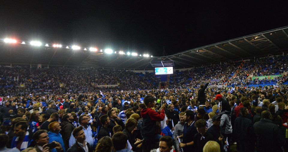  Reading fans on the pitch after their second leg victory over Fulham