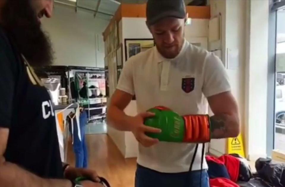  The Notorious laces up his new gloves ahead of a little sparring session