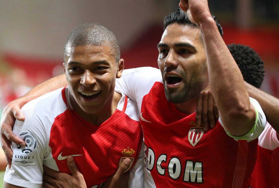  Kylian Mbappe celebrates with Radamel Falcao after the youngster netted in the 2-0 win against St Etienne