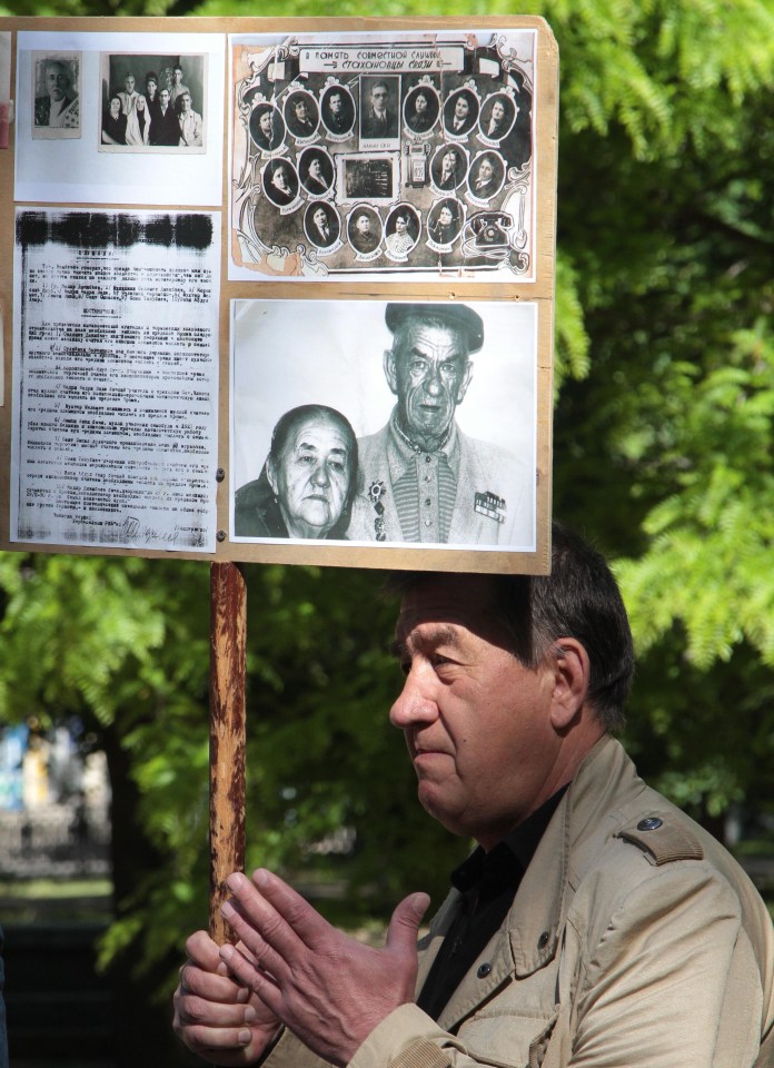 A local resident attends an event on Wednesday in memory of the victims of the 1944 Deportation of the Crimean Tatars