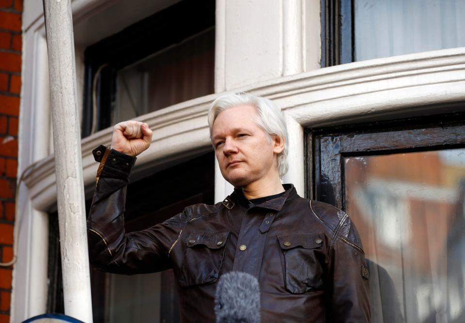  Assange raised his fist as he addressed the waiting media on the balcony of the embassy in West London