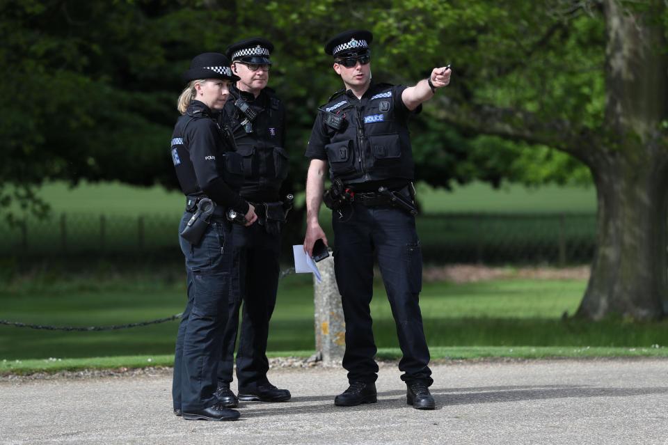  Police guarded the outside of the church where the wedding of the year took place at 11.30am