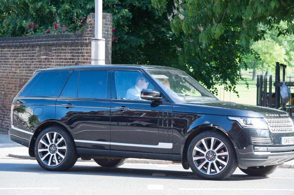  Wills wears sunglasses as he drives Range Rover to the wedding of sister-in-law Pippa